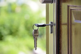 keys hanging from an entry door lock