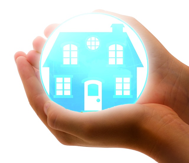 a glowing orb with a picture of a house in it, being held in a person's hands