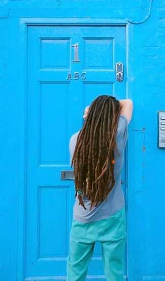 man leaning on door